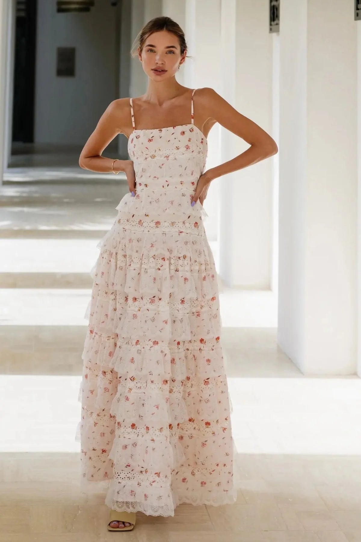 Woman wearing blush floral maxi dress with tiered lace skirt and adjustable straps — Anne Louise Boutique | Endless UAE