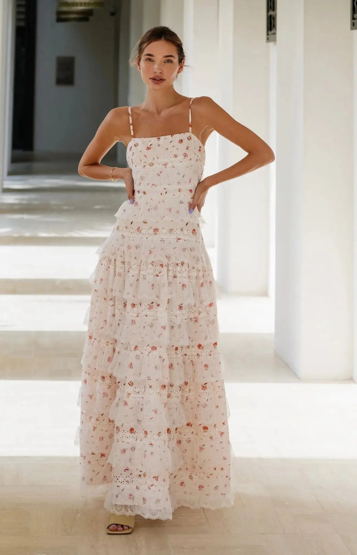 Woman wearing blush floral maxi dress with tiered lace skirt and adjustable straps — Anne Louise Boutique | Endless UAE