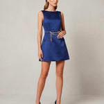 Woman modeling sapphire satin sleeveless mini dress with gold chain belt and navy heels — Elisabetta Franchi | Endless UAE