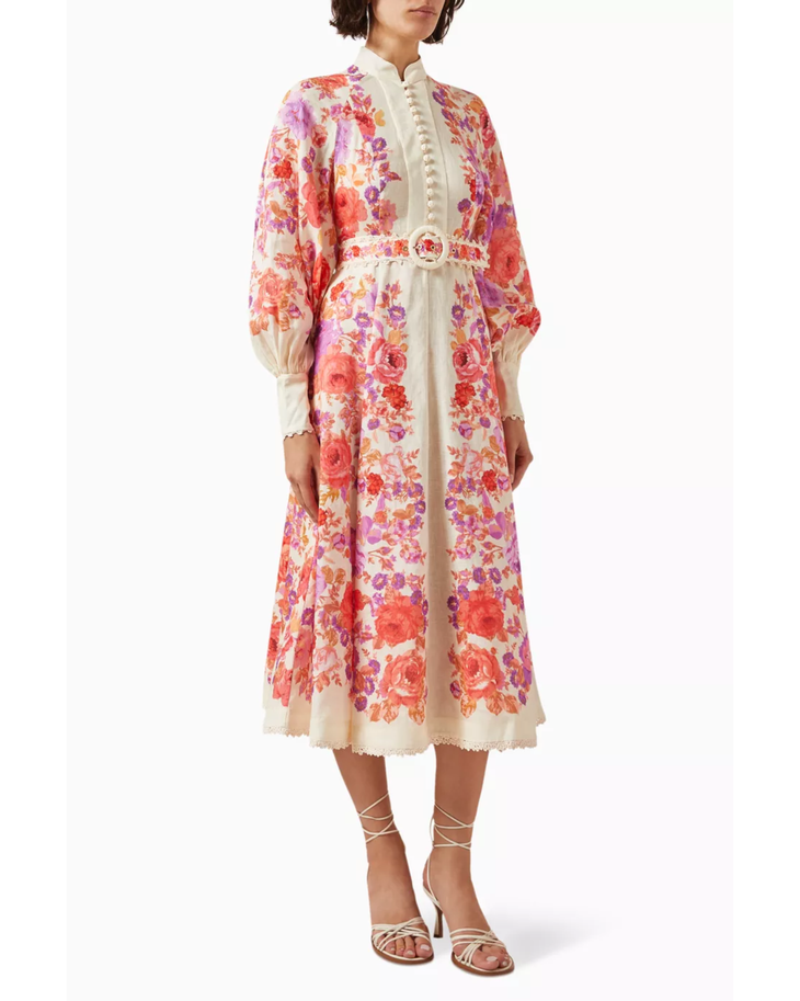 Woman wearing a floral-print midi dress with cream trim and matching strappy sandals — Zimmermann | Endless UAE