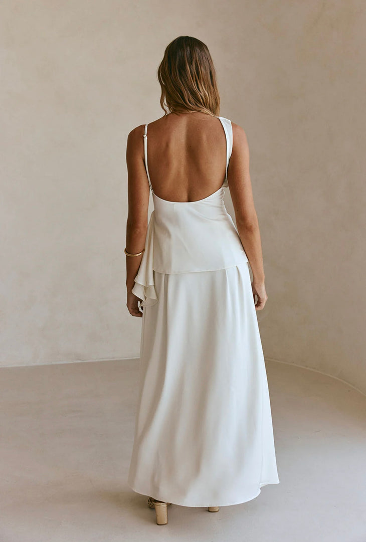 Woman modeling white sleeveless co-ord set with layered skirt and belt detail — Sabo | Endless UAE