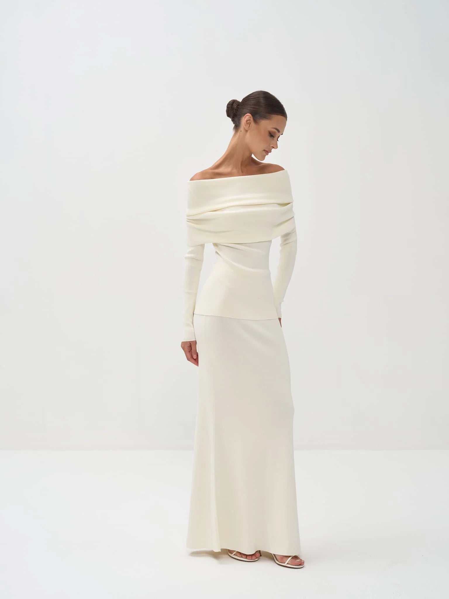 Cream off-shoulder knit top with long sleeves paired with matching maxi skirt — Nora The Label | Endless UAE
