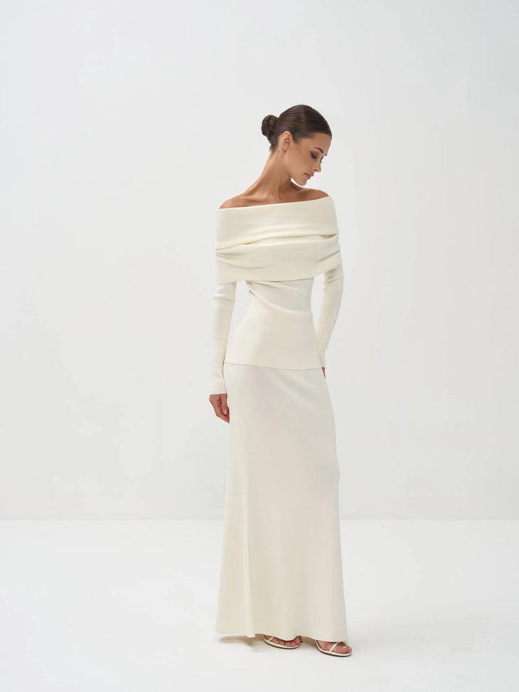 Cream off-shoulder knit top with long sleeves paired with matching maxi skirt — Nora The Label | Endless UAE