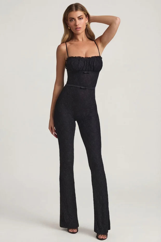 Black textured flared jumpsuit with ruched bustier top and thin straps — Oh Polly | Endless UAE