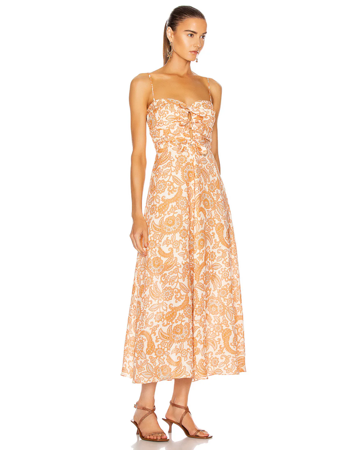 Woman wearing orange paisley tie dress with thin straps and midi length — Zimmermann | Endless UAE