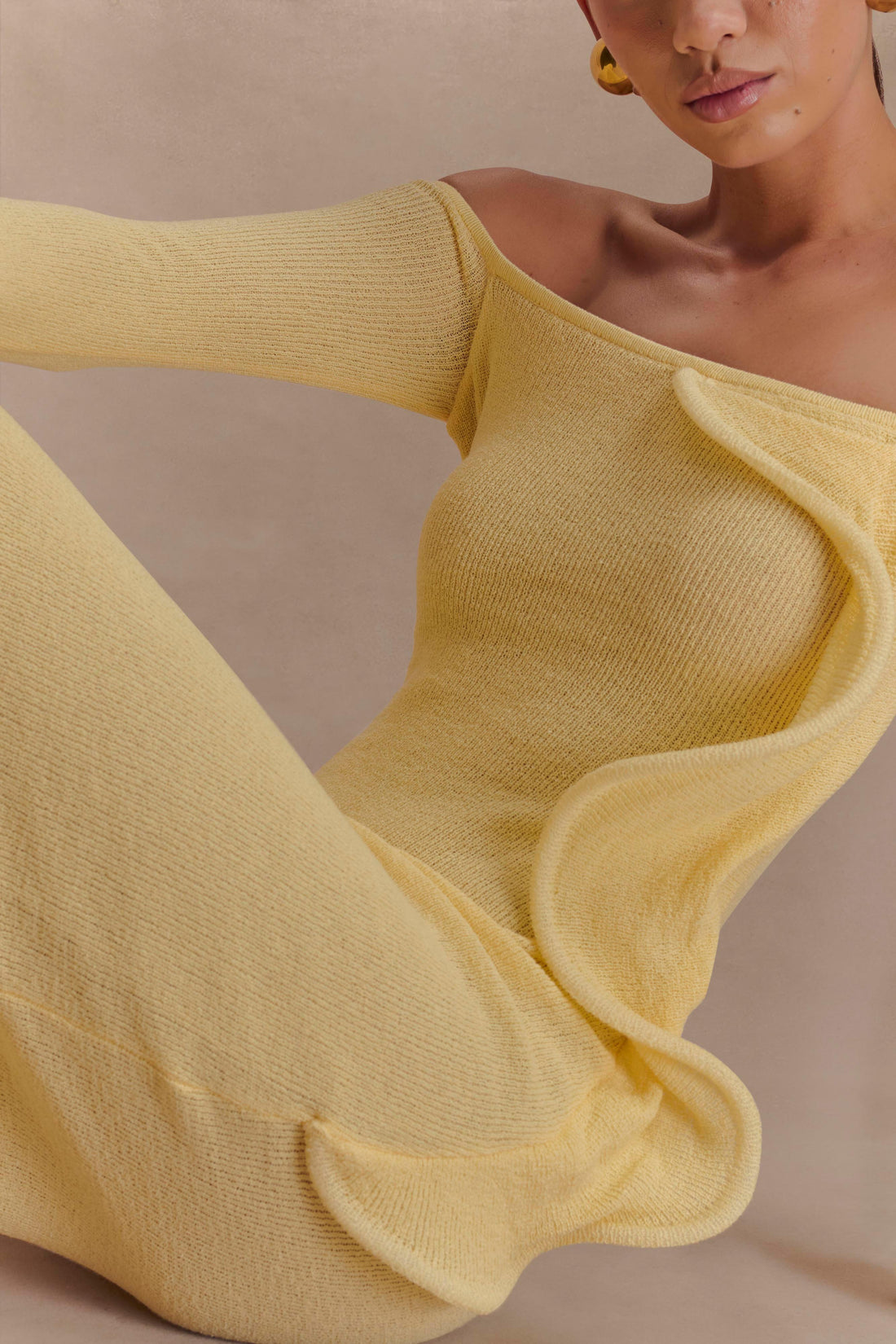 Woman wearing yellow off-shoulder ribbed knit maxi dress with ruffled details — Meshki | Endless UAE