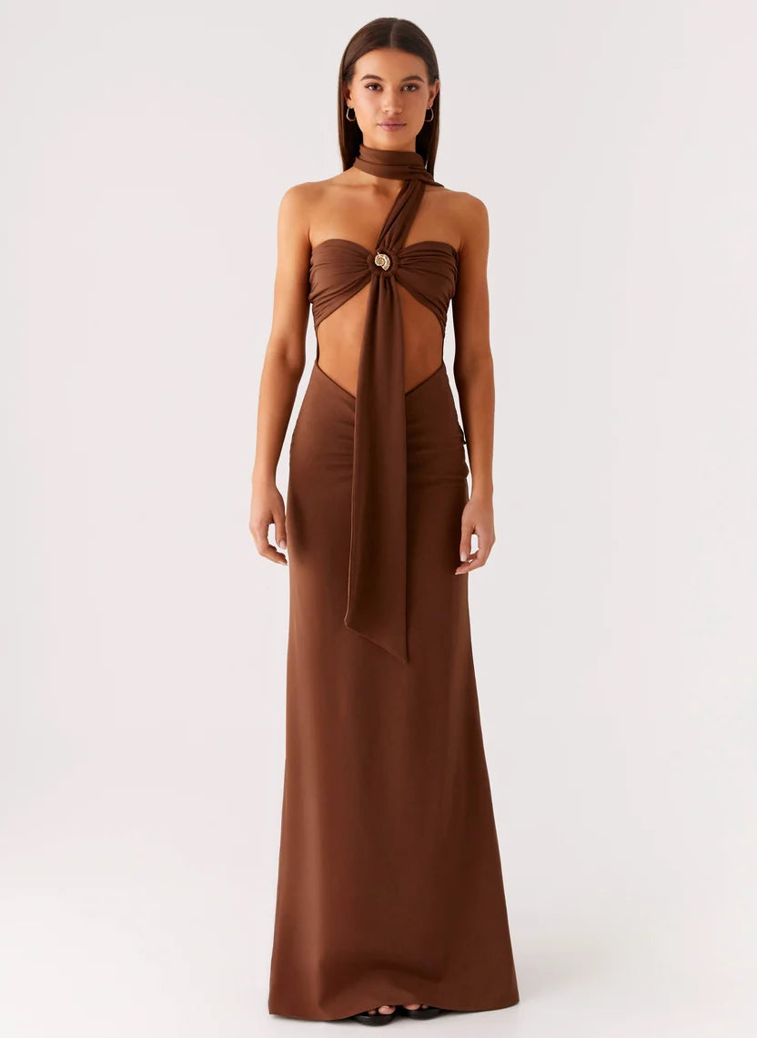 Woman wearing brown halter maxi dress with open back cutout detail — Peppermayo | Endless UAE