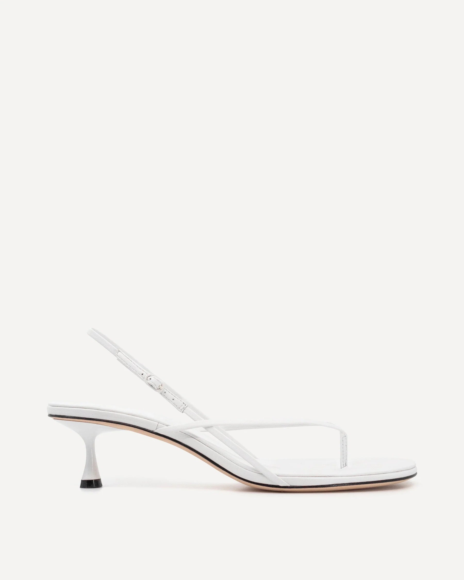 White leather slingback heel with curved wishbone design and sculpted kitten heel — Studio Amelia | Endless UAE