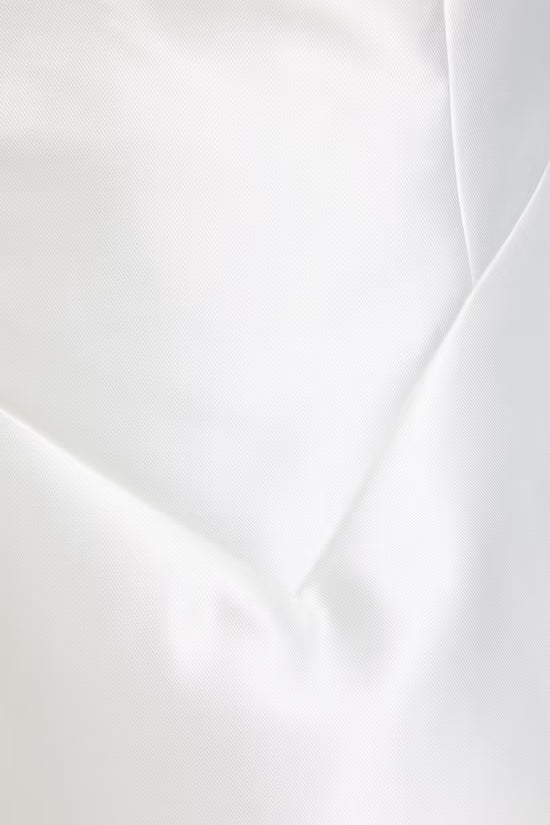 White sleeveless mini dress with deep V-back and pleated hem detail — Odd Muse | Endless UAE