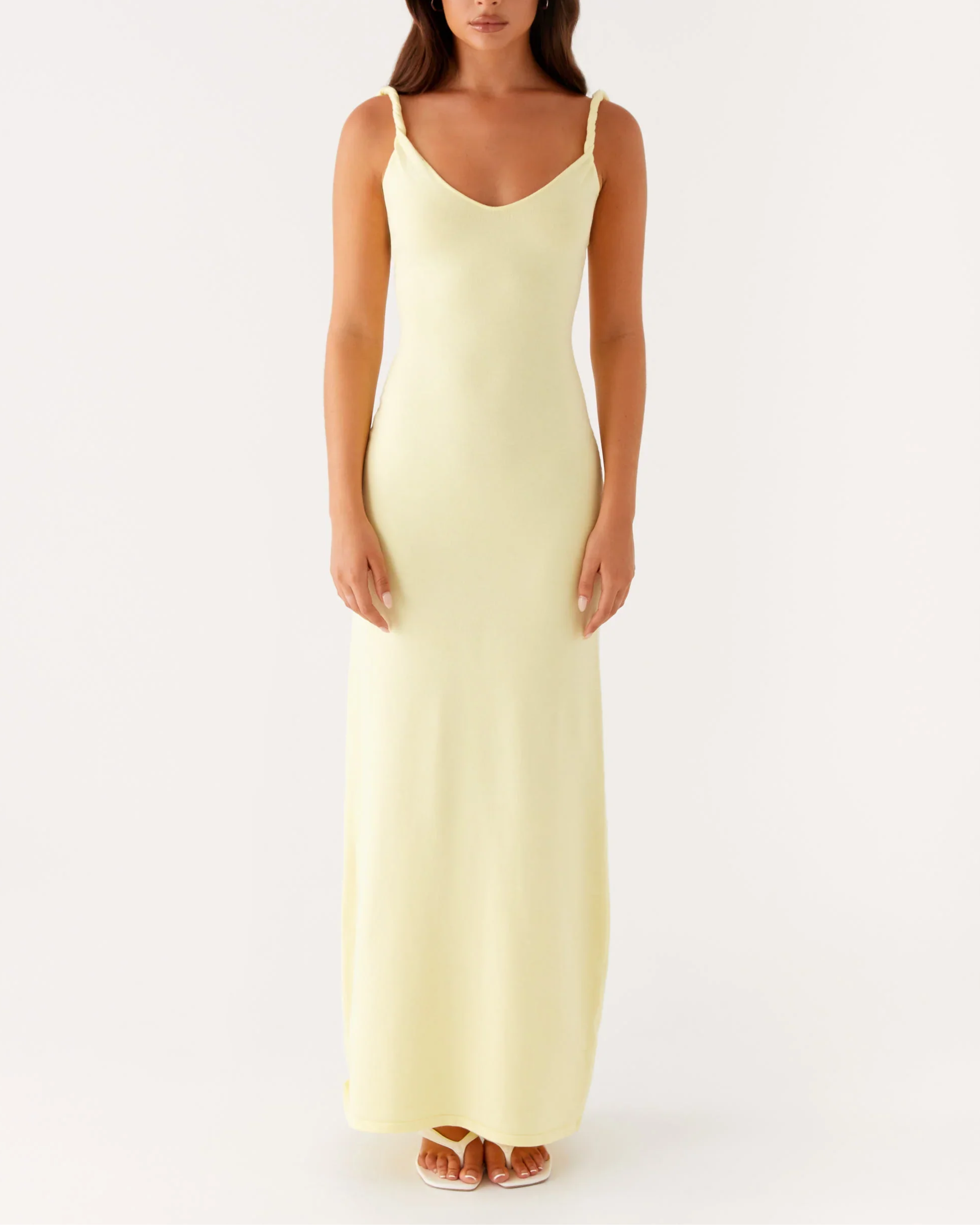 Woman wearing pale yellow sleeveless maxi dress with open back — Peppermayo | Endless UAE