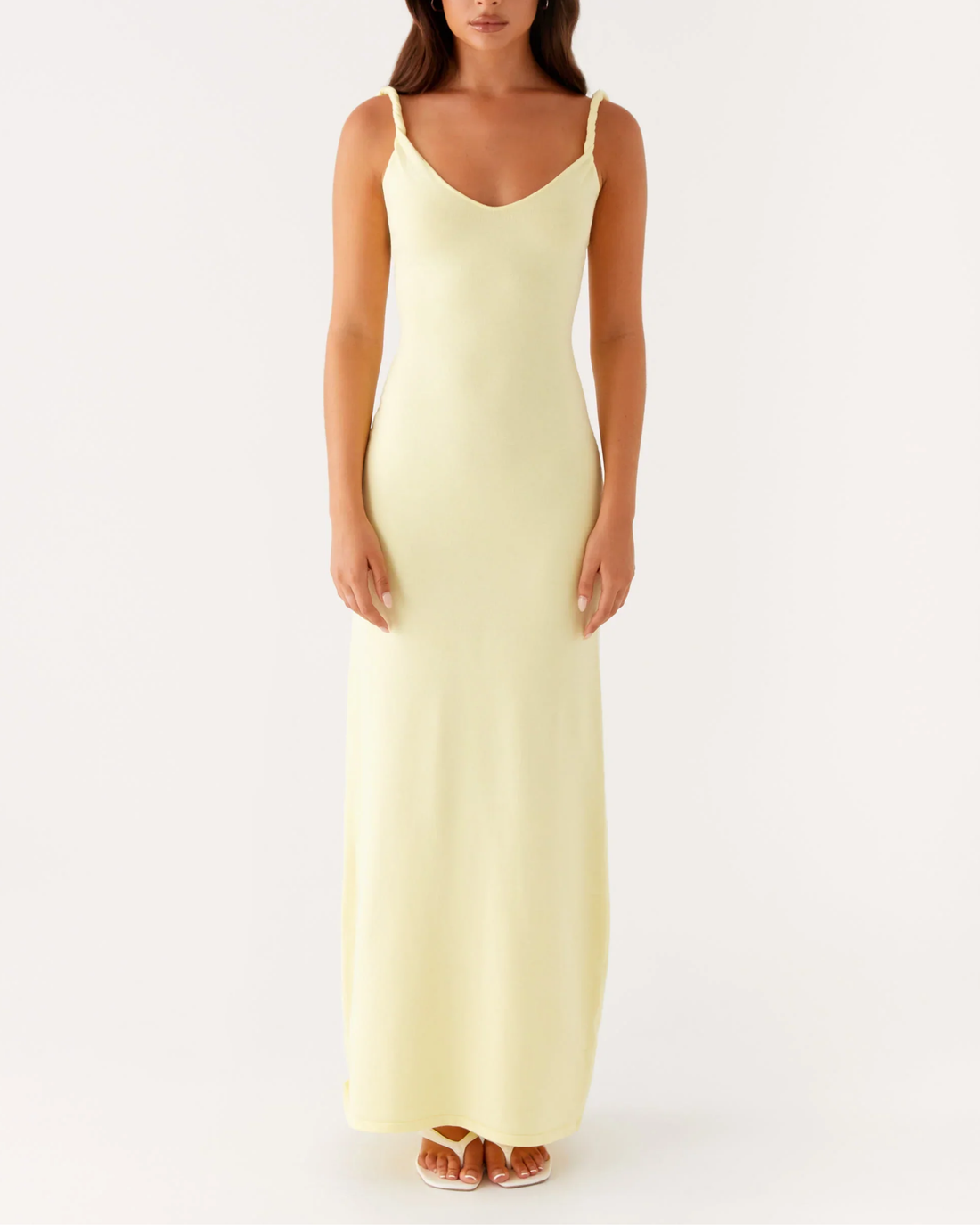 Woman wearing pale yellow sleeveless maxi dress with open back — Peppermayo | Endless UAE