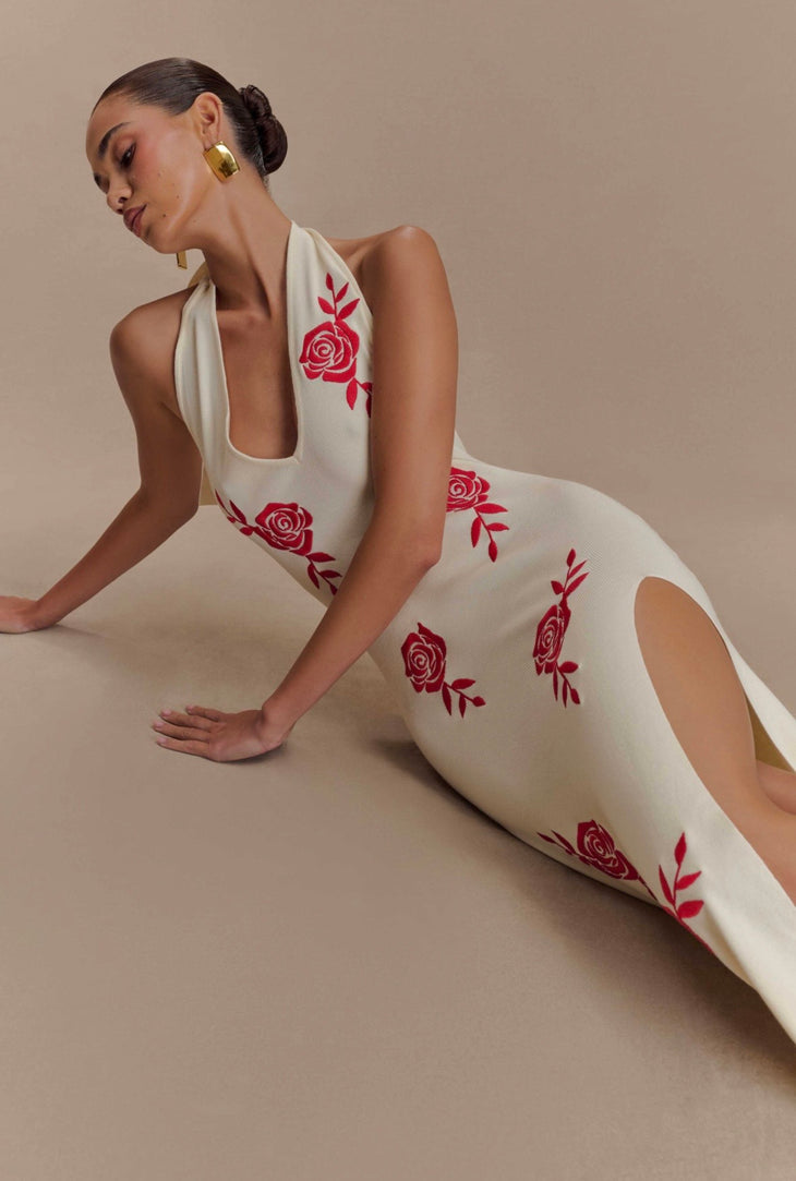 Woman wearing cream halter maxi dress with red rose embroidery and high slit — Meshki | Endless UAE