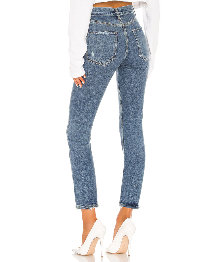 Woman wearing light wash high-rise straight crop jeans with white crop top and white platform shoes — Agolde | Endless UAE