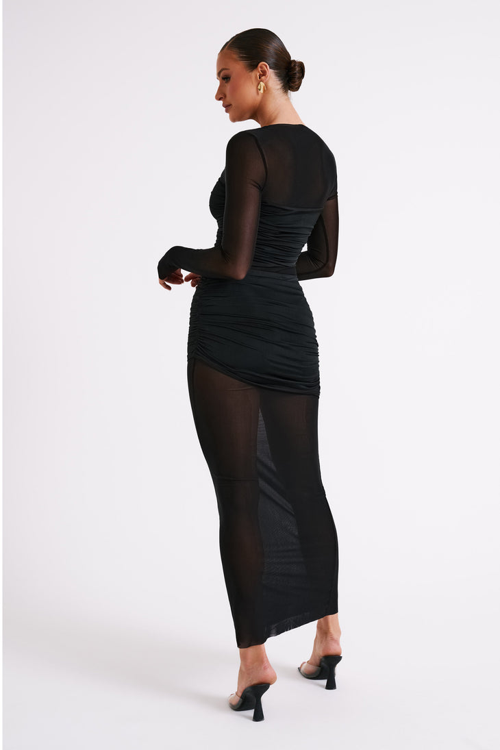 Woman wearing black mesh and nylon maxi dress with long sleeves and ruching — Meshki | Endless UAE
