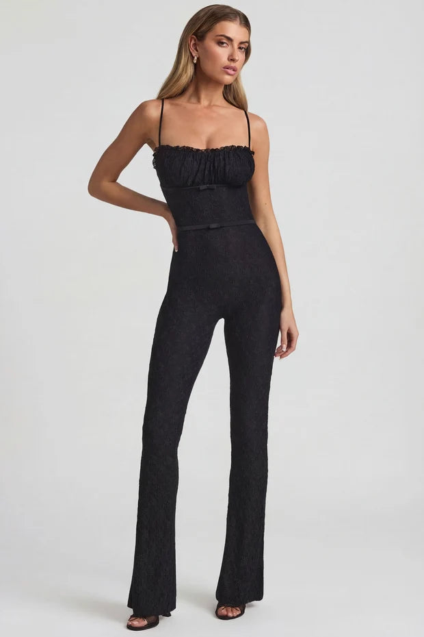 Black textured flared jumpsuit with ruched bustier top and thin straps — Oh Polly | Endless UAE