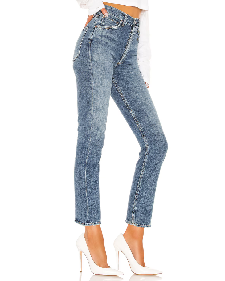 Woman wearing light wash high-rise straight crop jeans with white crop top and white platform shoes — Agolde | Endless UAE