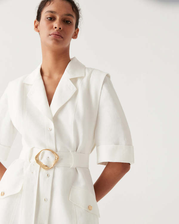 Lyric Belted Mini Dress in white linen with short sleeves and gold buckle belt — Aje | Endless UAE