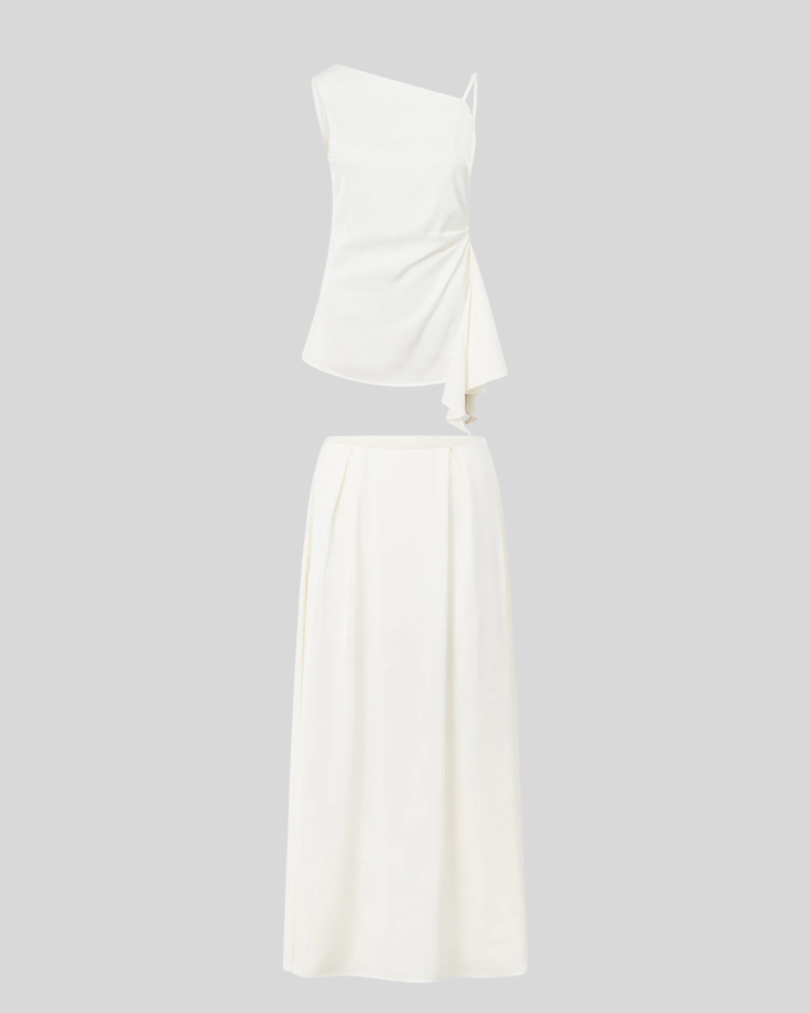 Woman wearing white sleeveless Hailey Co-ord Set with layered skirt and strappy sandals — SABO | Endless UAE