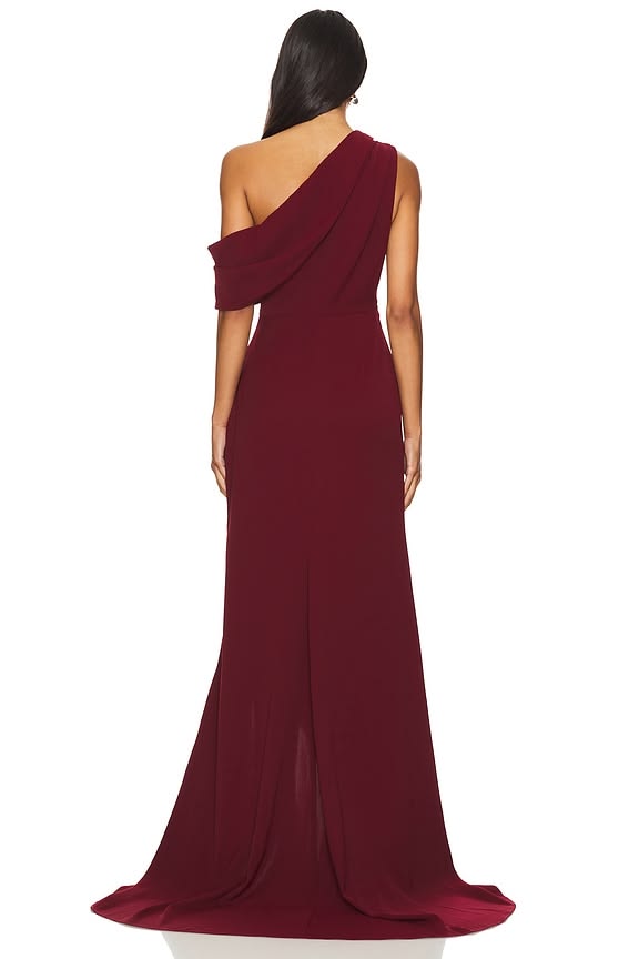 Burgundy one-shoulder draped gown with high slit and flowing fabric — Elliat | Endless UAE