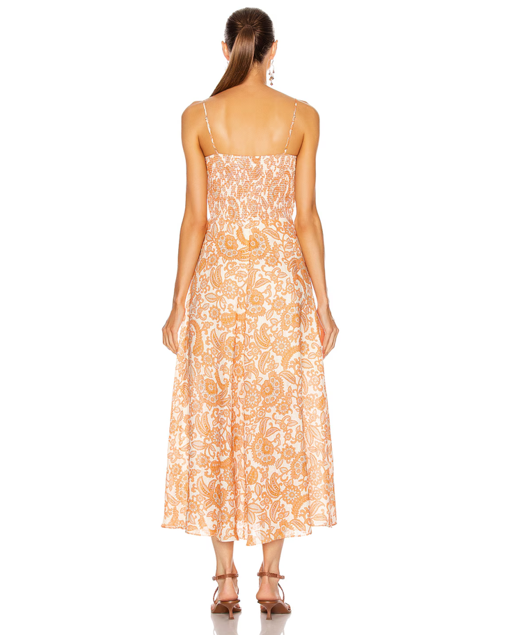 Woman wearing orange paisley tie dress with thin straps and midi length — Zimmermann | Endless UAE
