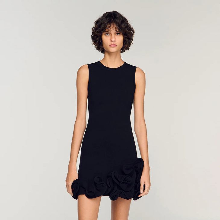 Black sleeveless knit dress with floral ruffle hem detail — Sandro | Endless UAE