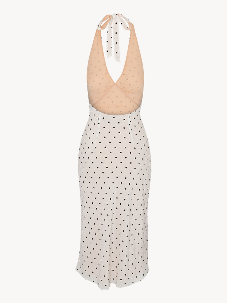 Woman wearing white halter midi dress with black polka dots — Réalisation Par | Endless UAE