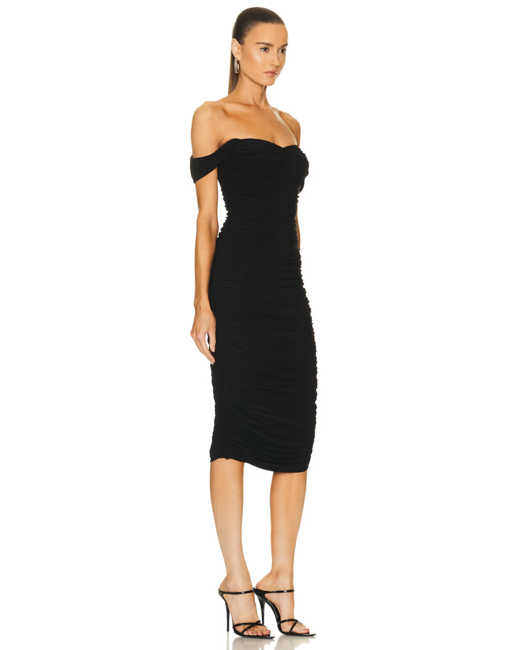 Woman wearing black off-shoulder ruched midi dress with bow details — Norma Kamali | Endless UAE