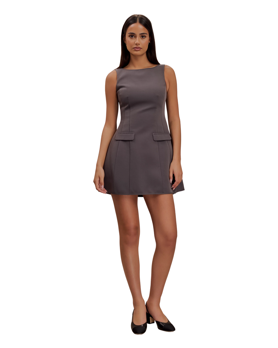 Woman wearing charcoal sleeveless suiting mini dress with front pockets and black platform heels — Meshki | Endless UAE