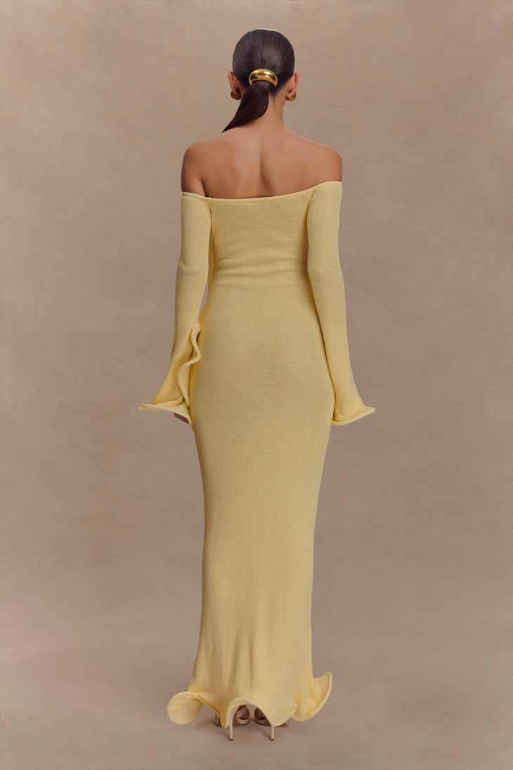Woman wearing yellow off-shoulder ribbed knit maxi dress with ruffled details — Meshki | Endless UAE