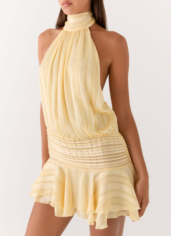 Pale yellow pleated halter chiffon mini dress with ruched waist detail — Peppermayo | Endless UAE