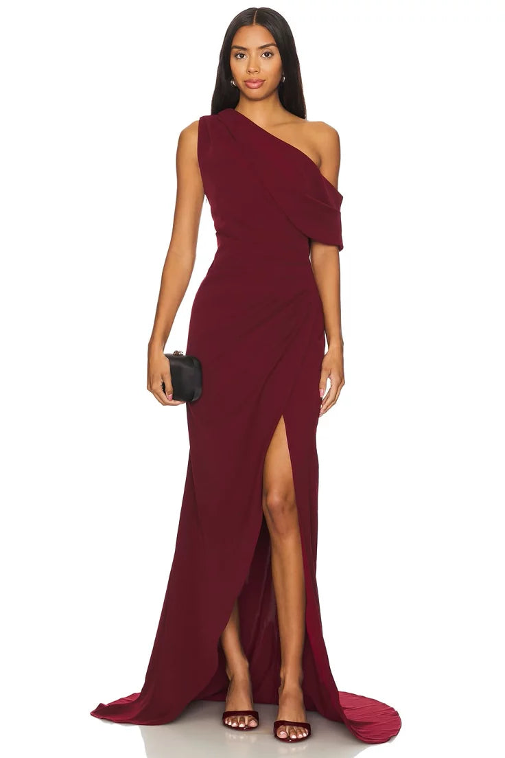 Burgundy one-shoulder draped gown with high slit and flowing fabric — Elliat | Endless UAE
