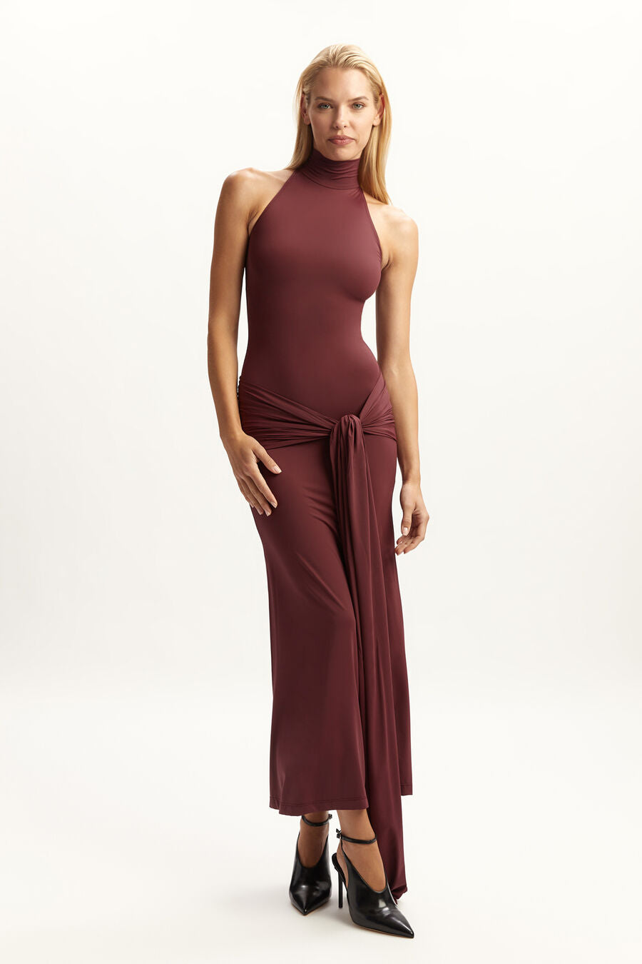 Woman wearing burgundy halterneck maxi dress with front tie detail — Chic Le Frique | Endless UAE