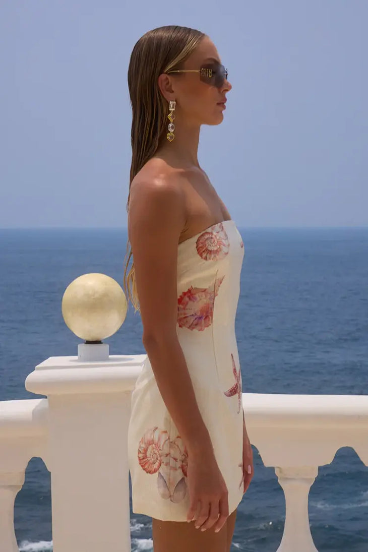Cream sequin mini dress with red starfish and shell details, strapless design — Runaway The Label | Endless UAE