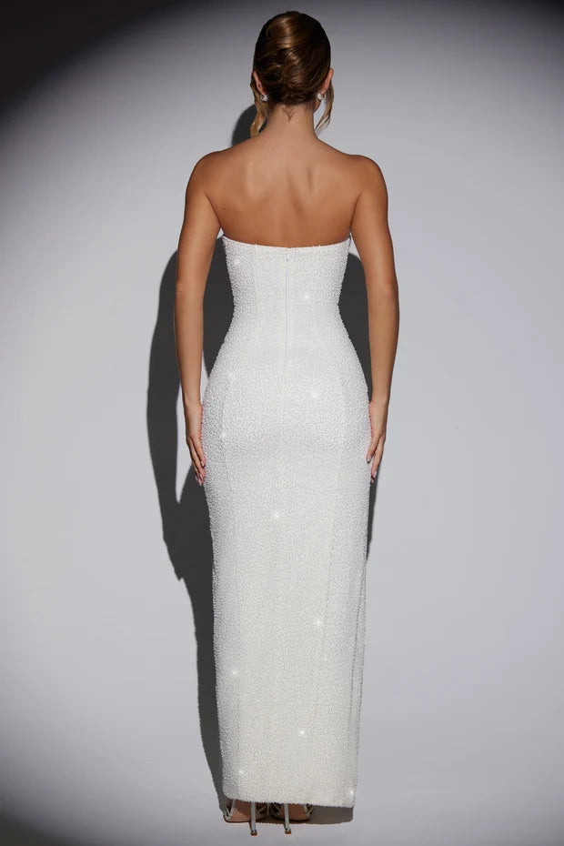 Woman wearing white sequin bandeau maxi dress with cowl neck and high slit — Oh Polly | Endless UAE