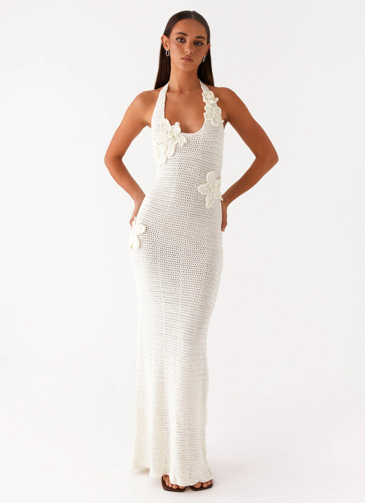 Woman wearing cream crochet halter maxi dress with floral appliqués — Peppermayo | Endless UAE