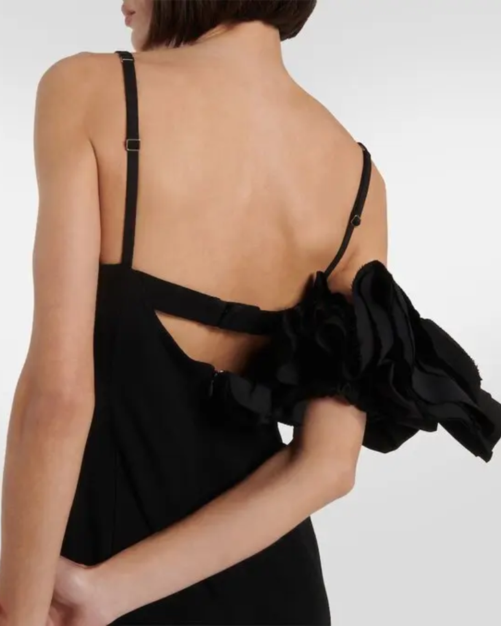 Black mini dress with bow detail and open back, styled with heels and handbag — Jacquemus | Endless UAE