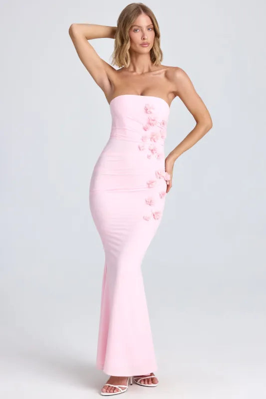 Woman wearing pink strapless maxi dress with floral appliqué details — Oh Polly | Endless UAE