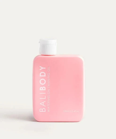 Bali Body Watermelon Tanning Oil SPF6 in pink bottle with white cap — Powder Beauty | Endless UAE