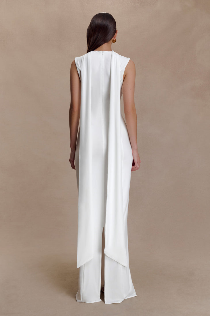 Woman modeling white sleeveless turtleneck maxi dress with flowing fabric — Meshki | Endless UAE