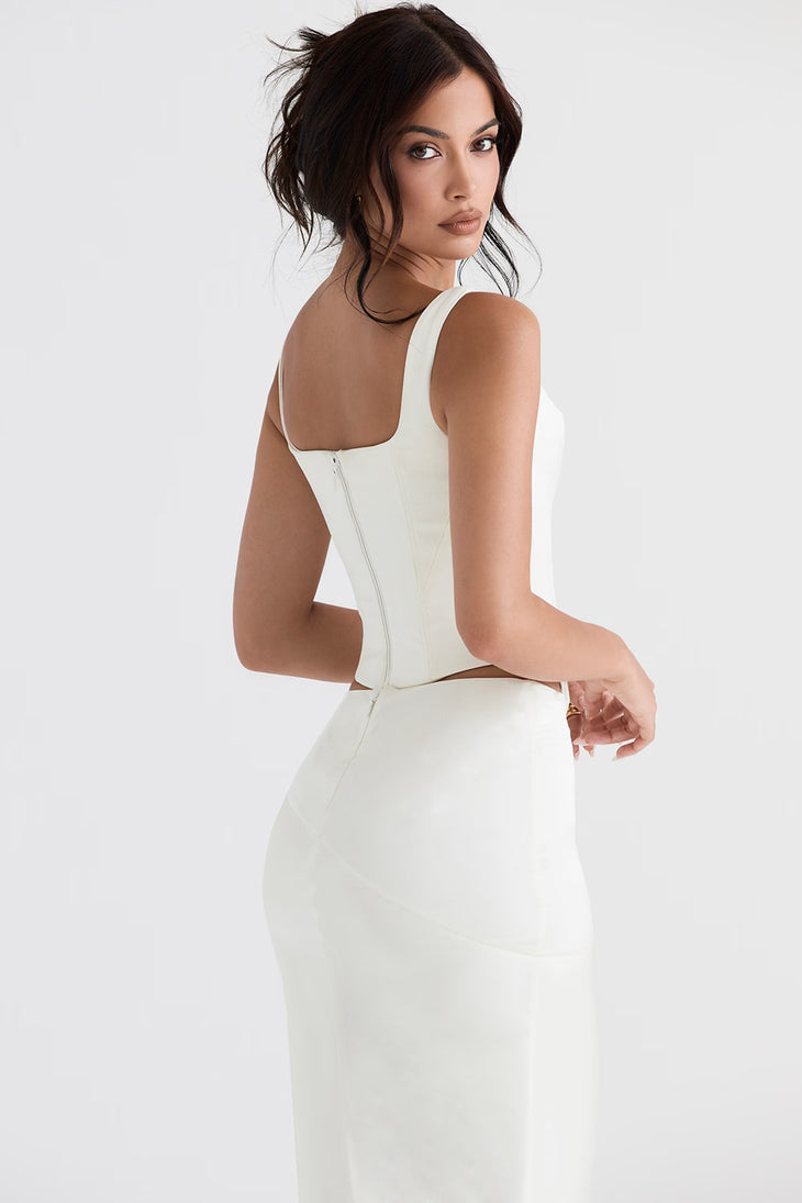 Woman wearing white satin longline corset with cutout sides and square neckline — House of CB | Endless UAE