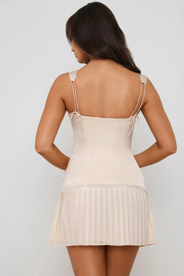 Cream lace-up corset mini dress with pleated skirt detail — Oh Polly | Endless UAE