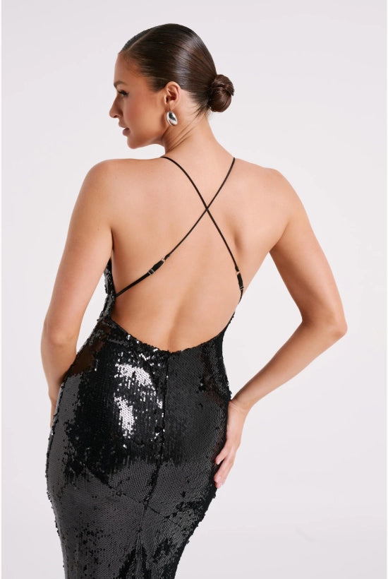 Woman wearing black sequin maxi dress with open back and thin straps — Meshki | Endless UAE