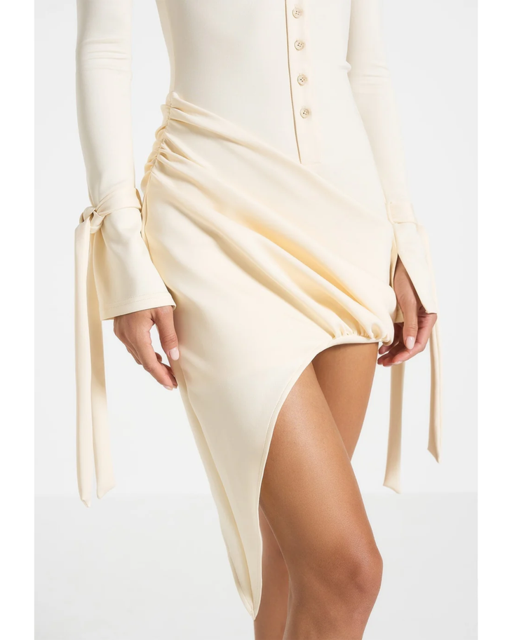 Cream draped asymmetric mini dress with long sleeves and tie detail — Maniere De Voir | Endless UAE