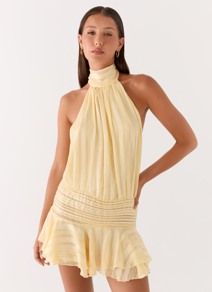 Pale yellow pleated halter chiffon mini dress with ruched waist detail — Peppermayo | Endless UAE