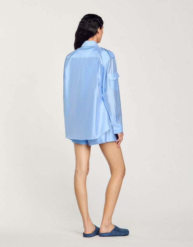 Light blue oversized shirt with chest pockets worn open — Sandro | Endless UAE