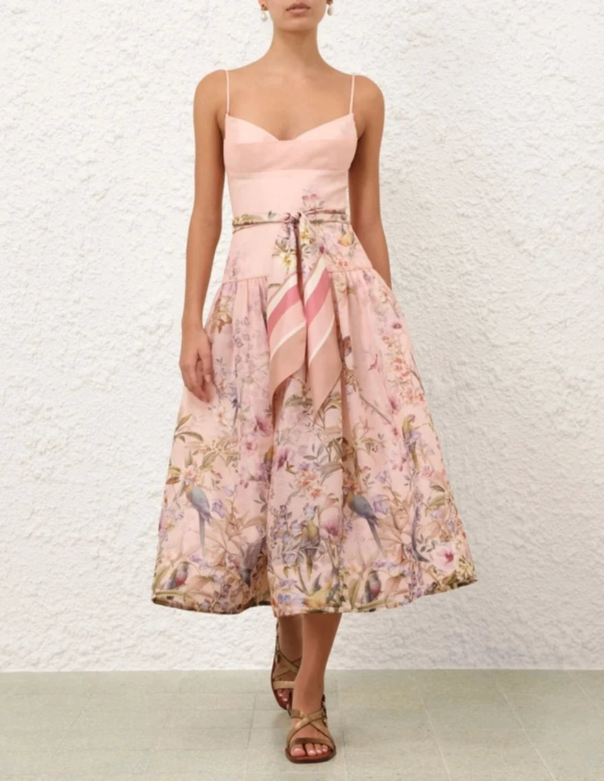 Woman wearing Rebellion Fitted Picnic Dress in pink with floral print, featuring sweetheart neckline and midi length — Zimmermann | Endless UAE