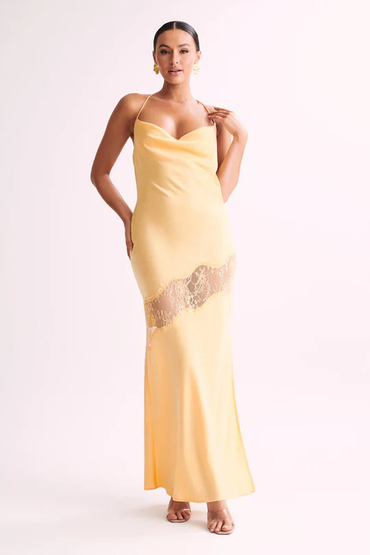 Woman wearing yellow Chandra Lace Dress with cowl neckline and lace side cutout — Meshki | Endless UAE