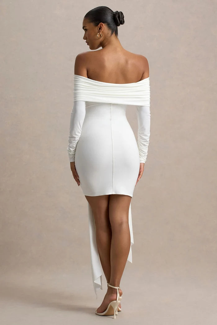 Woman wearing white Bardot wrap mini dress with off-shoulder design and long sleeves — Club L London | Endless UAE