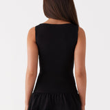 Black sleeveless mini dress with ruched waist and tiered frill skirt — Peppermayo | Endless UAE