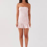 Young Heart Mini Dress in blush pink with strapless neckline and ruffled hem — Peppermayo | Endless UAE